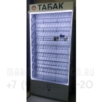 Сигаретный шкаф на гравитационных полках с рулонной шторкой с подсветкой